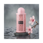 Now Women Rave 100ml EDP by Lattafa, elegantly displayed with pink flowers on a wet stone surface.